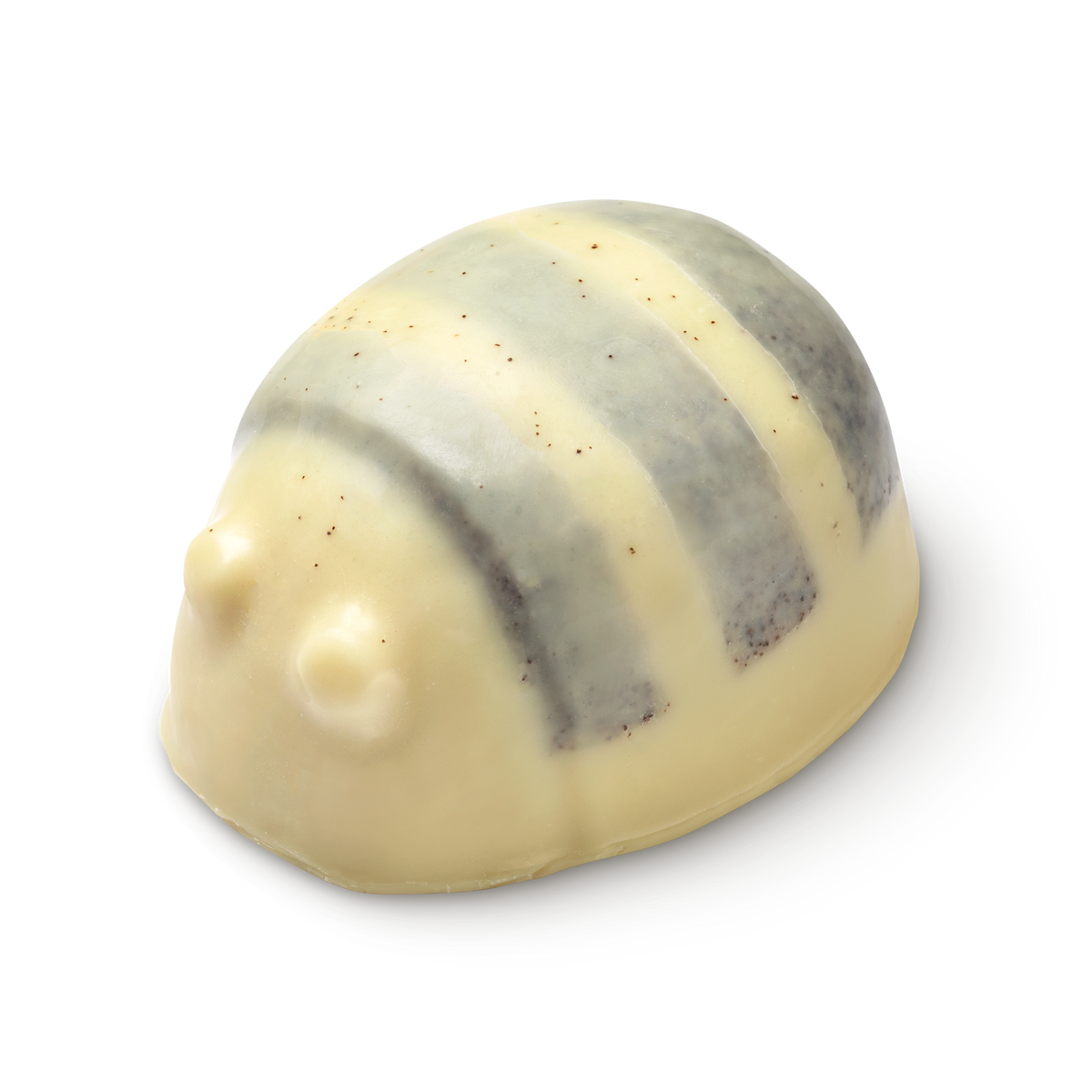 Scrubee solid body butter. The image shows a pale cream, bee-shaped product with a rounded top and small eyes. It features three, textured stripes across its back, appearing smooth and solid.